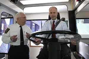Dan Grabauskas learns how to use the new MBTA bus simulator.